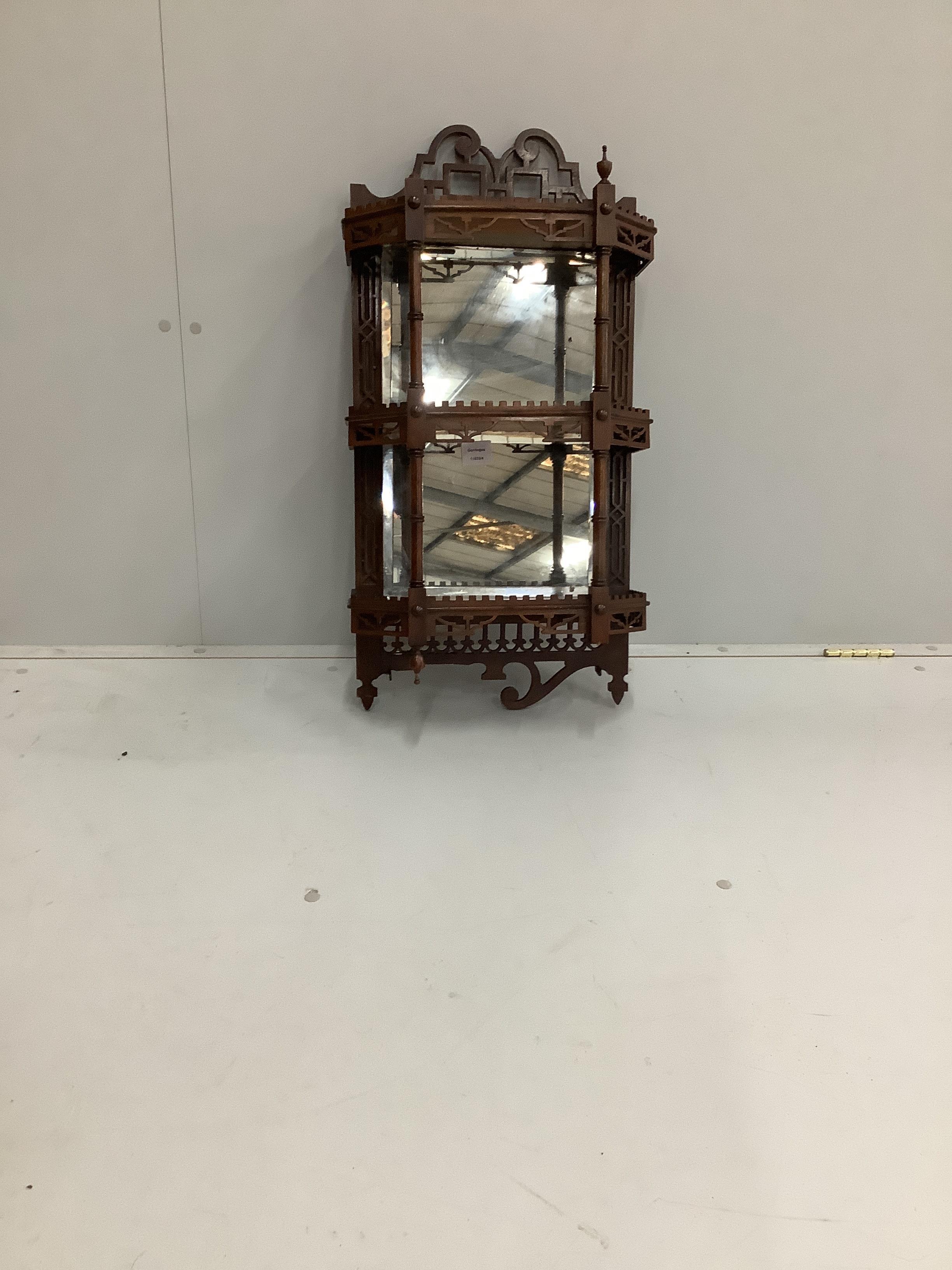 A late Victorian mahogany three tier mirrored wall bracket, width 40cm, height 76cm